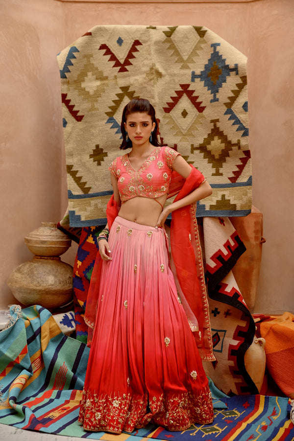 Red and coral ombre ruched lehenga with blouse and dupatta