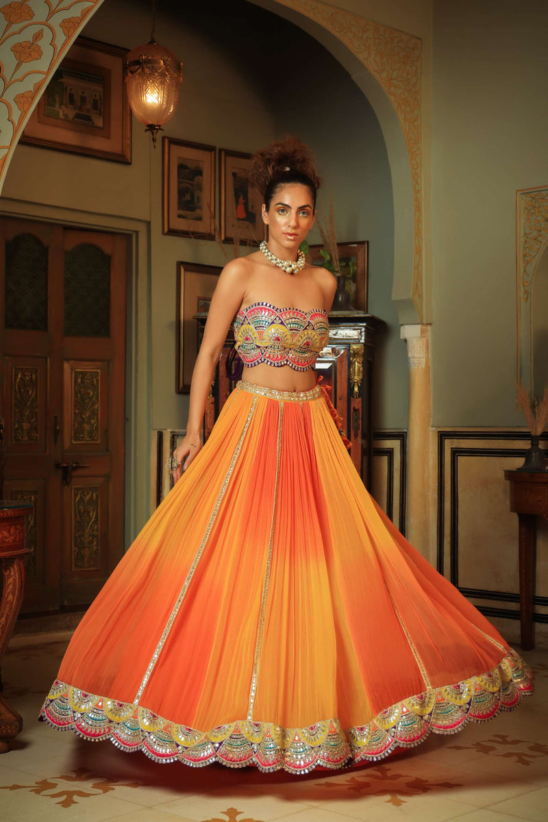 Dilruba bejewelled gotapatti bandeau blouse and sunset ombre lehenga and scalloped shrug set