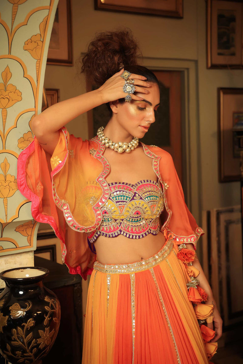 Dilruba bejewelled gotapatti bandeau blouse and sunset ombre lehenga and scalloped shrug set